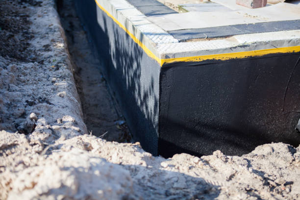 Professional Waterproofing technician working in Wheeler, MI
